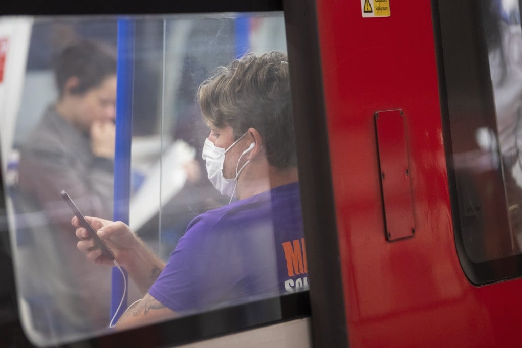 A headphone-wearing commuter in London. A study by audio firm Jabra reveals more than a third of British headphone users wear them to avoid having to talk to other people, and that the average Briton goes five weeks without speaking to someone new. Photo: Getty Images