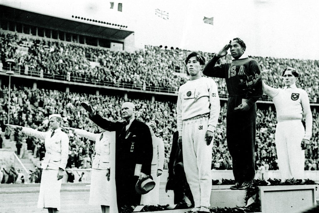 Bronze medallist in the long jump Naoto Tajima of Japan, gold medallist Jesse Owens of the United States and silver medallist Lutz Long of Germany salute during the medals ceremony on August 11, 1936, at the Summer Olympics in Berlin. Owens dominated the 1936 games with four gold medals, refuting Nazi claims of white racial superiority; he and Long reportedly became lifelong friends. Photo: AP