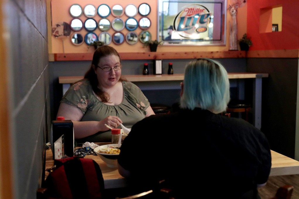 Allison McCorkle, left, has dinner with friend Vash Strandboe. McCorkle identifies as asexual and aromantic. Photo: John J. Kim/Chicago Tribune/TNS