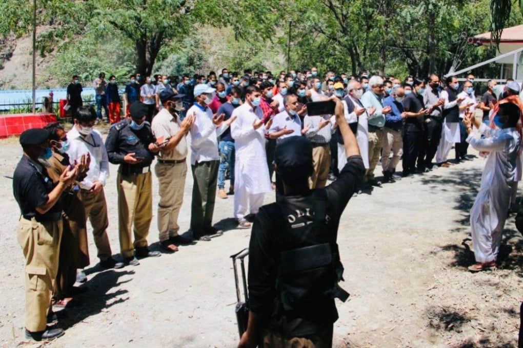 People pray for the victims of the Dasu terrorist attack at an August 4 ceremony held at Barseen residential camp. Photo: SCMP Source
