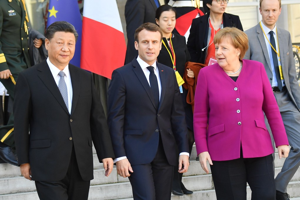 French President Emmanuel Macron (centre) accompanies President Xi Jinping (left) and German Chancellor Angela Merkel (right) after their meeting at the Elysee Presidential Palace in Paris on March 26, 2019. Photo: Getty Images