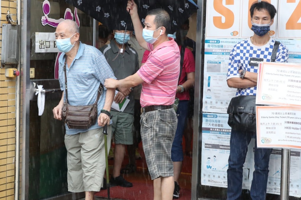 People queue up for the Sinovac vaccine at Kowloon Bay Sports Centre. We need to vaccinate the most vulnerable in the city and learn to live with Covid-19 in our midst, says a Hong Kong doctor. Photo: Edmond So