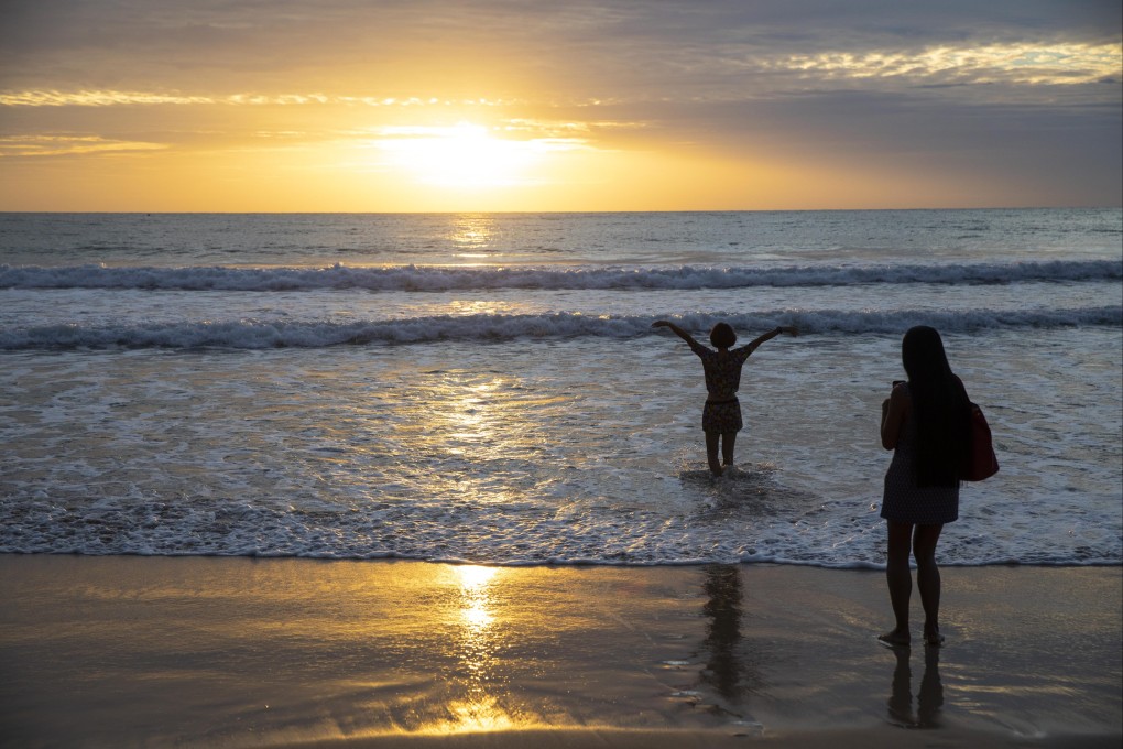 Tourists on an almost deserted Patong Beach in Phuket on July 19. Under the “Phuket sandbox” scheme, vaccinated tourists are allowed to travel to the resort island without needing to quarantine. Photo: Bloomberg
