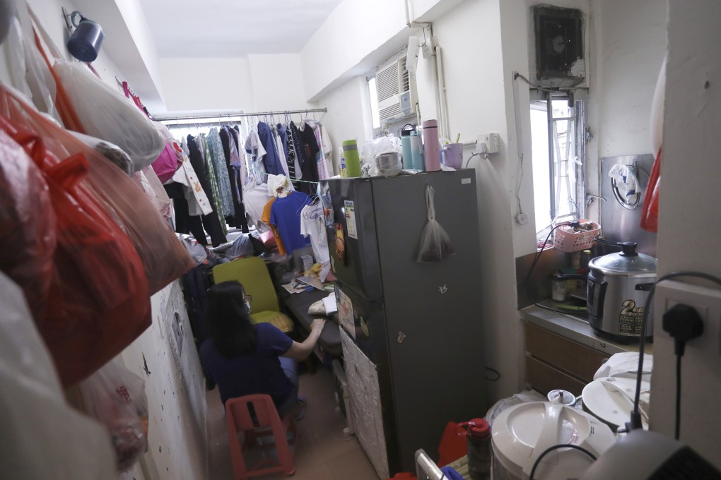 A woman rests at her subdivided flat in Mong Kok on August 13. Photo: Jonathan Wong