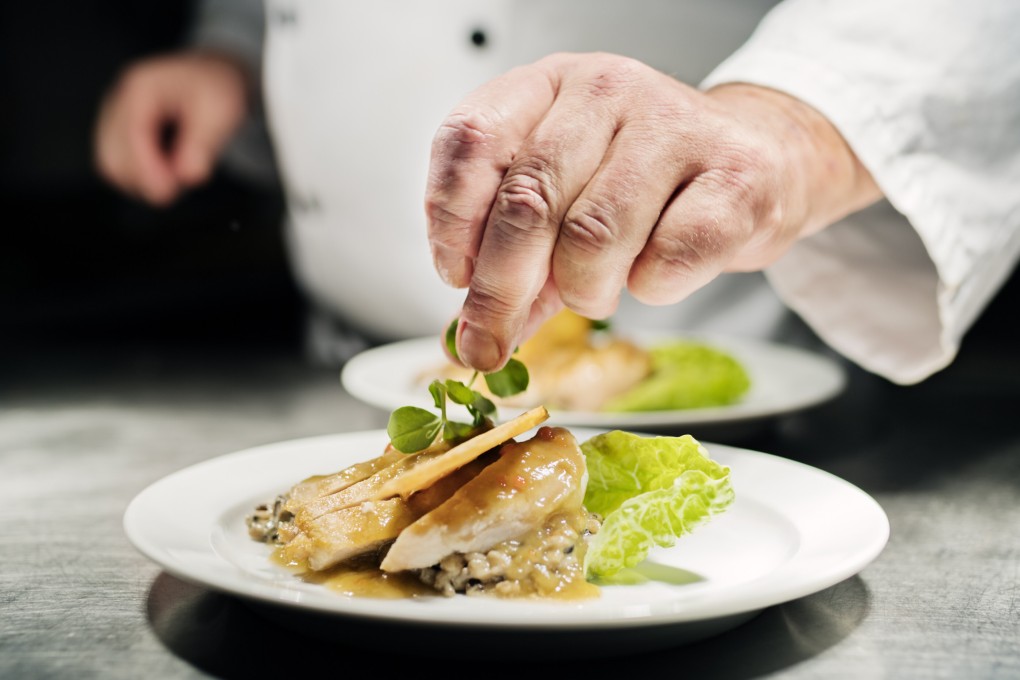 A chef adds the final flourish to a dish. Smart chefs will take advantage of seasonal ingredients that are the freshest, most flavourful and cheapest, which is why it’s funny when one boasts about changing their menu. Photo: Getty Images