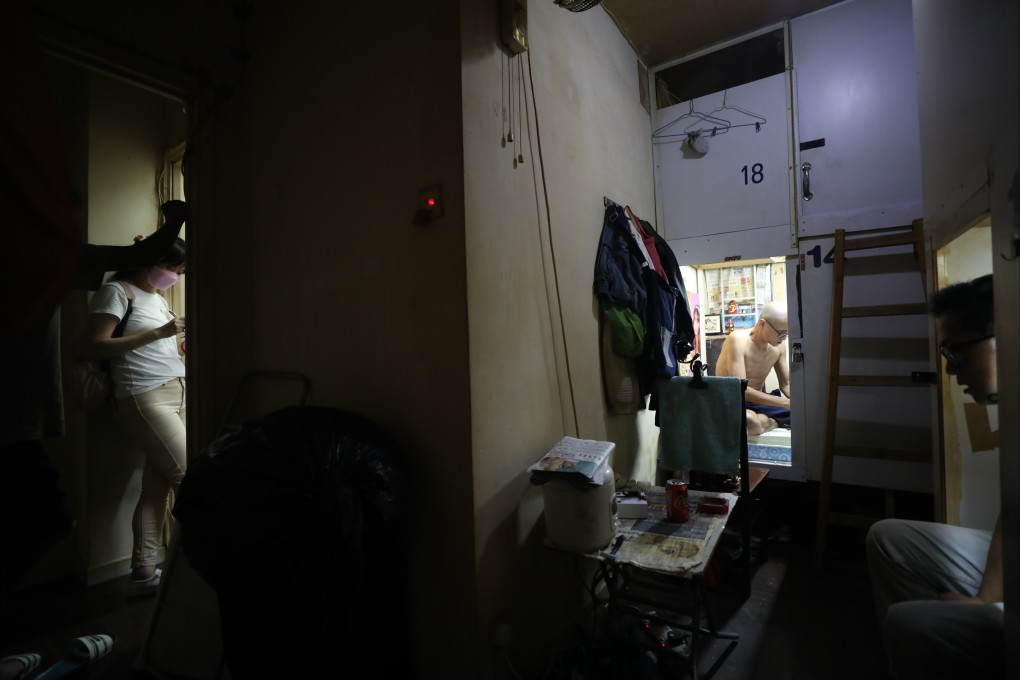 People go about their lives in a flat subdivided into 18 sections in Yau Ma Tei on August 3. Photo: Xiaomei Chen