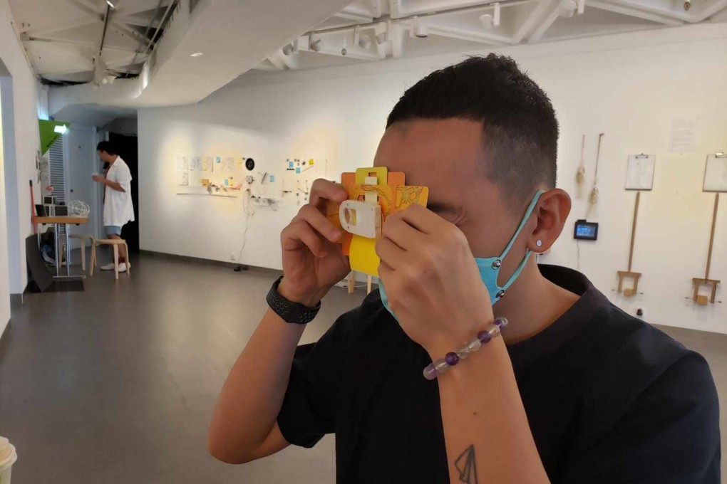 Wong Wing-tong holds a mini microscope used to view tiny objects collected around Hong Kong’s Wan Chai district. He is one of four artists at the Goethe-Institut using various means to explore the relationship of Hong Kong people to their city after two years of dramatic change. Photo: Jess Ma