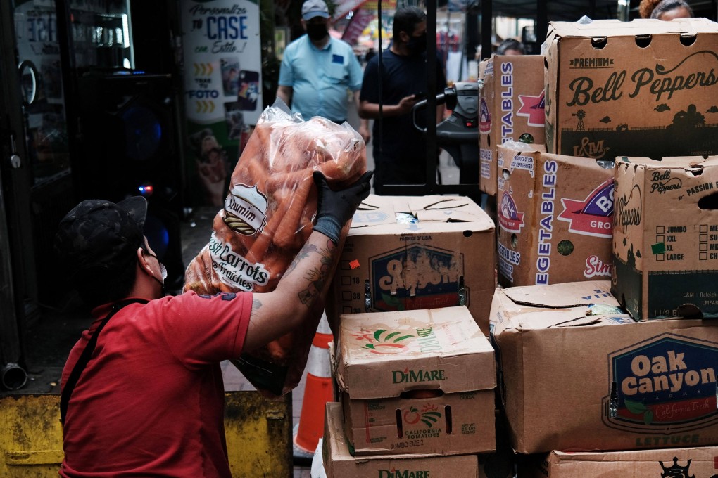 A worker unloads food in the Queens borough of New York City on June 4. Average wage-earners’ salaries have failed to keep up with inflation. Photo: AFP