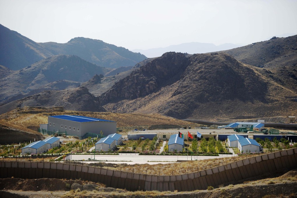 A camp set up by a state-owned Chinese mining company sits mostly empty near a protective wall in the arid mountains of Mes Aynak in Afghanistan on October 10, 2012. Photo: AFP