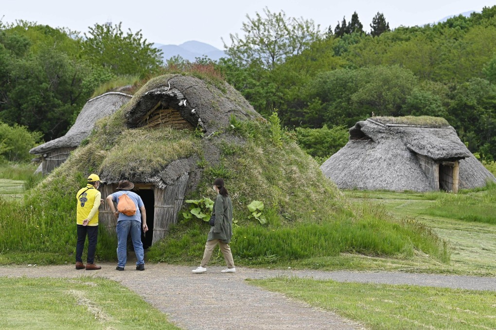 Visitors look at a reconstructed Jomon house at the Sannai Maruyama archeological site in northern Japan, one of 17 that have collectively been inscribed on Unesco’s World Heritage List. The listing has renewed hopes of reviving tourism in the Tohoku region. Photo: Getty Imags