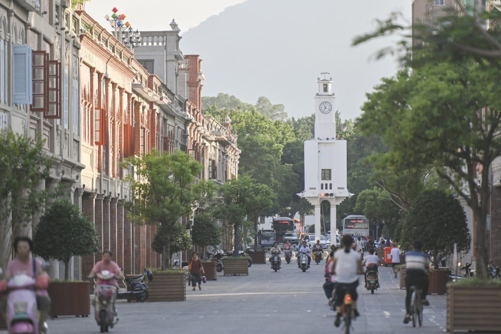 Residents pass the Bell Tower early in the morning in Quanzhou, in southeast China’s Fujian province, recently inscribed by Unesco on its World Heritage List. Photo: Xinhua