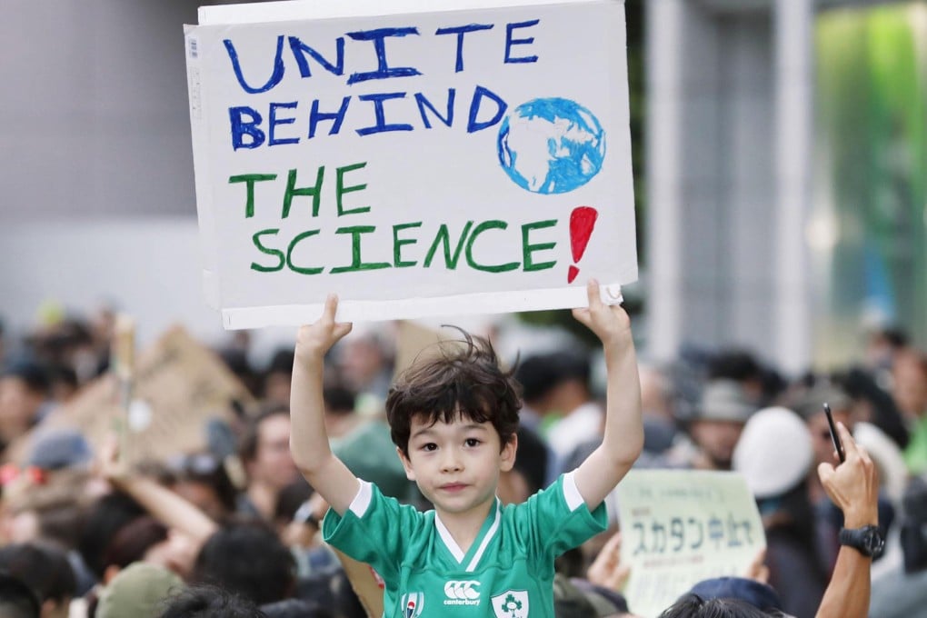 A boy joins the climate change rally in Tokyo, Japan on September 20, 2019. Photo: Kyodo News