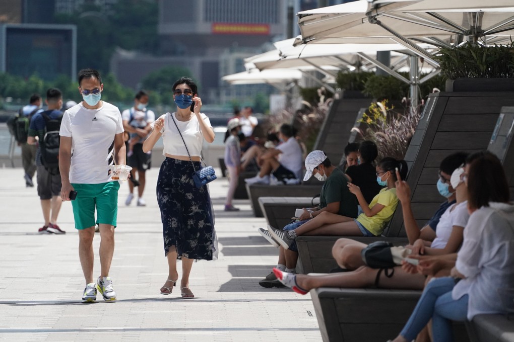 Hongkongers out and about along the Tsim Sha Tsui waterfront on July 11. Photo: Felix Wong