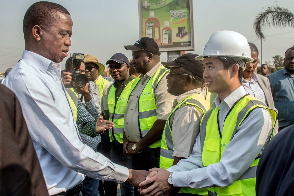 Then Zambian president Edgar Lungu (left) meets Chinese workers from the Aviation Industry Corporation of China, in Lusaka, Zambia, on September 15, 2018. Lungu’s party has been accused of failing to fight for Zambian interests in its dealings with China. Photo: AFP