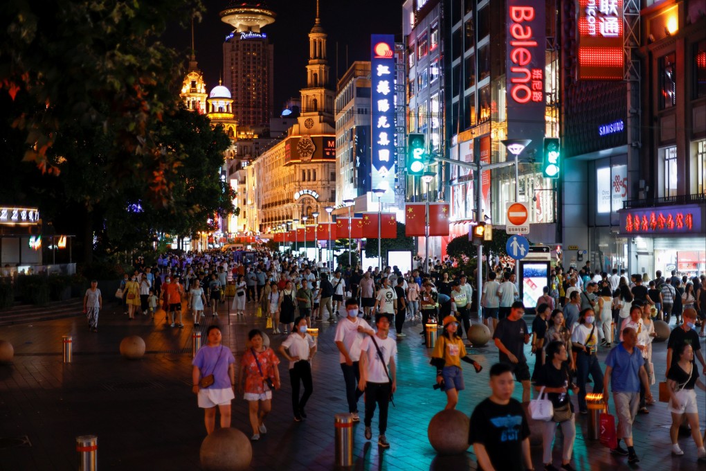 People throng a shopping area in Shanghai on July 12. Retail sales growth might have slowed, but underlying consumer confidence remains strong. Photo: Reuters