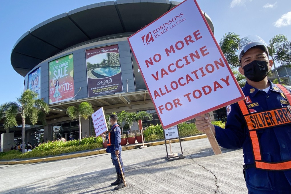 Security officers turn away people at a vaccination centre in Metro Manila’s Las Pinas City, in the Philippines, on August 6. Whether the Delta variant prolongs the pandemic appreciably will depend on how long it takes to address the inequities in the production and distribution of vaccines globally. Photo: EPA-EFE