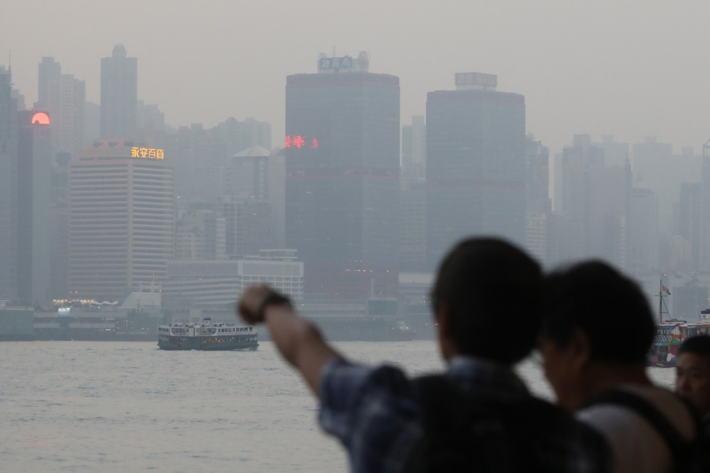 Victoria Harbour is shrouded in a haze of pollution on November 12, 2018. Along with other developed economies, Hong Kong should rapidly “degrow” if the world is to avoid climate catastrophe. Photo: Sam Tsang