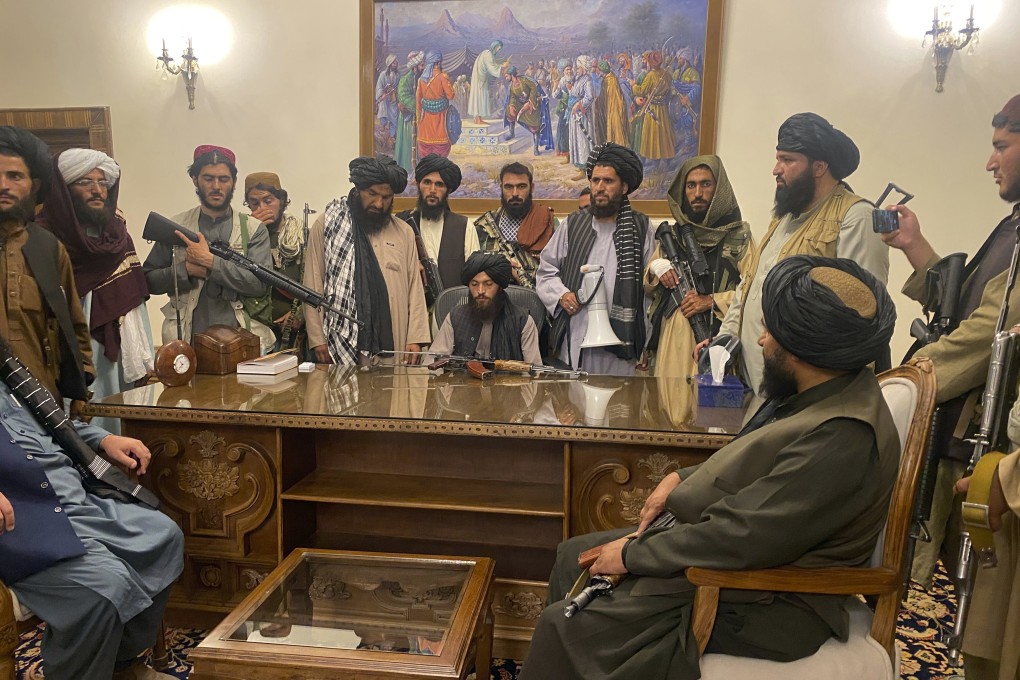 Taliban fighters after taking control of the Afghan presidential palace on August 15. Photo: AP
