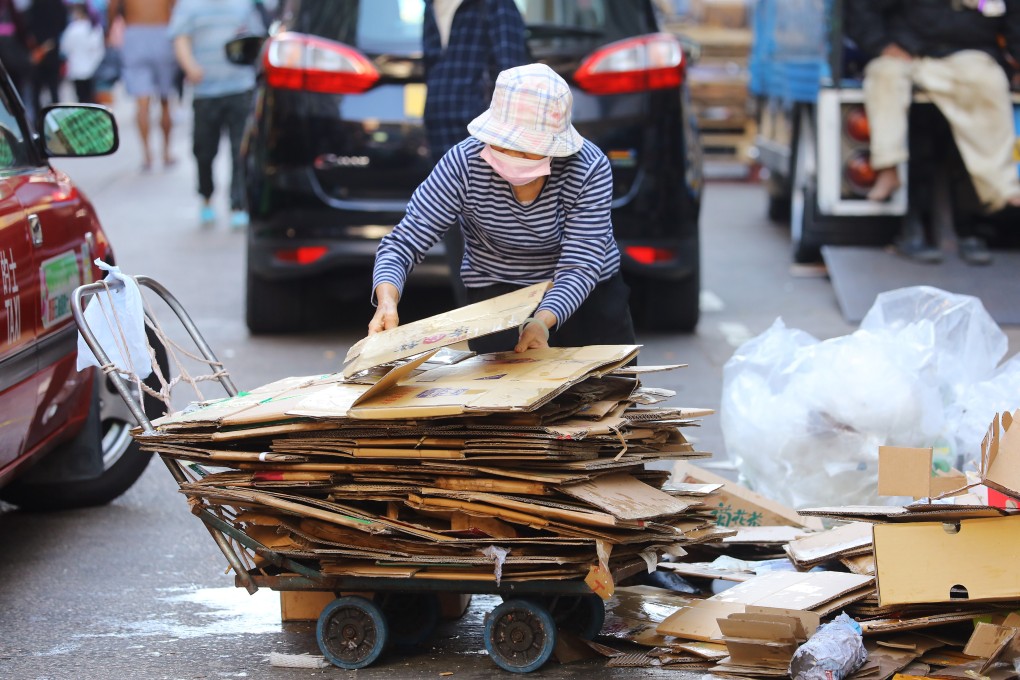 An elderly woman collects cardboard on the streets in Sham Shui Po in December 2020. The poor have been disproportionately affected by the economic fall-out of Covid-19. Photo: Dickson Lee