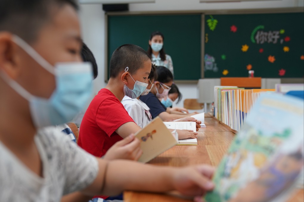 Children read books as part of a summer vacation activity organised by a primary school in Beijing on July 19. In China as in elsewhere, parents are driven by the hypercompetitive culture to try and use whatever resources they have to game the system in favour of their children. Photo: Xinhua