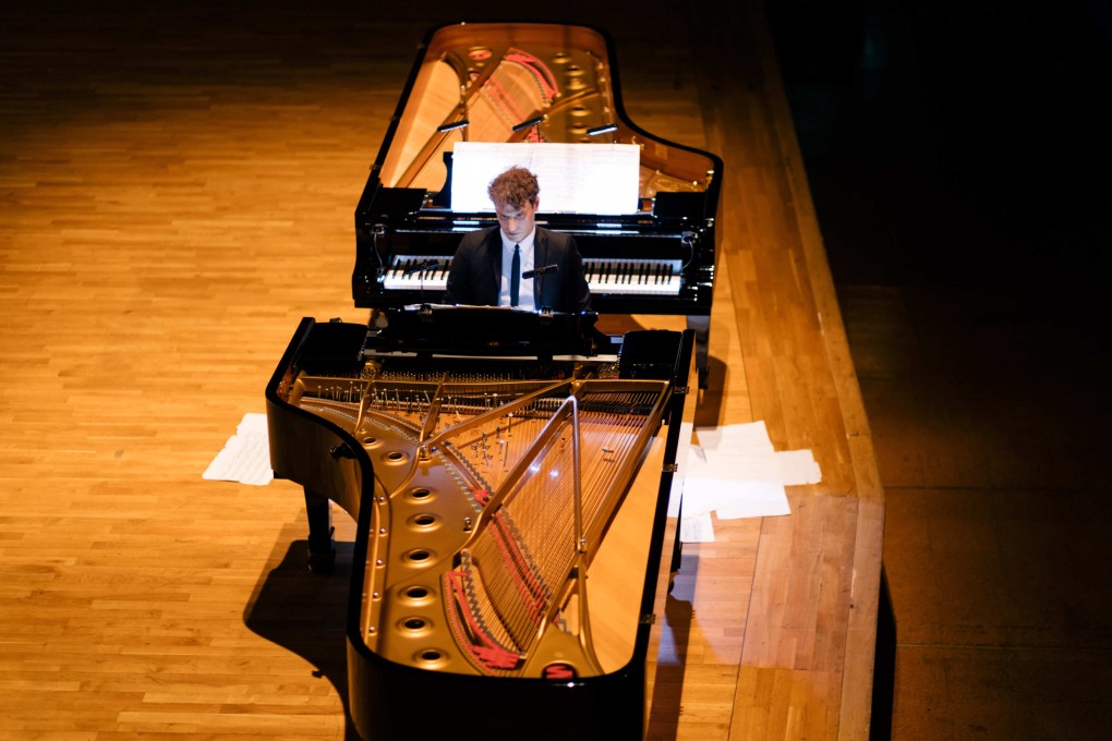 David Greilsammer swivelled from one piano to another, alternating between Domenico Scarlatti’s 18th century sonatas and John Cage’s 20th century avant garde compositions, in his Hong Kong concert. After playing each piece he threw the score onto the stage. Photo: Kenny Cheung / Premiere Performances of Hong Kong