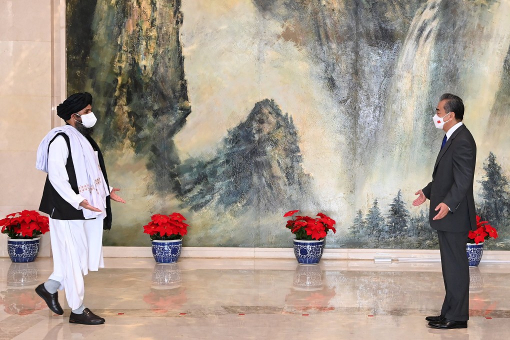 Mullah Abdul Ghani Baradar, political chief of the Taliban, meets Foreign Minister Wang Yi in Tianjin on July 28. Photo: Xinhua