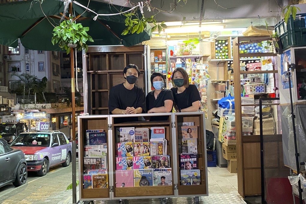 As part of the “Via North Point” project, artists at Cou Tou Woodworking Studio designed a new display cabinet for a woman surnamed Ng (centre), who has run a news stand in the area for more than two decades, which saves her nearly two hours of labour a day. Photo: Hong Kong Arts Centre