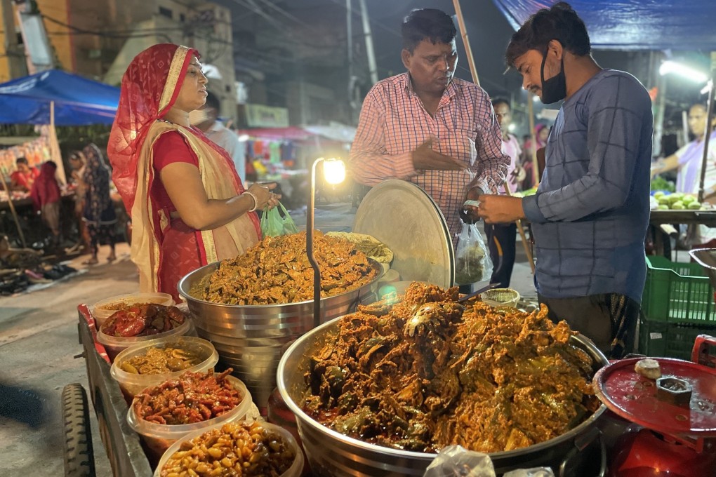 A pickle seller at a street market in India. Photo: Rakesh Kumar
