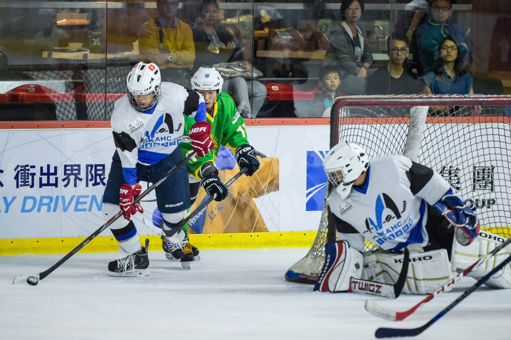 Goalie Jonathan Ha (right) of the Hong Kong Amateur Hockey Club Giants defends a play.