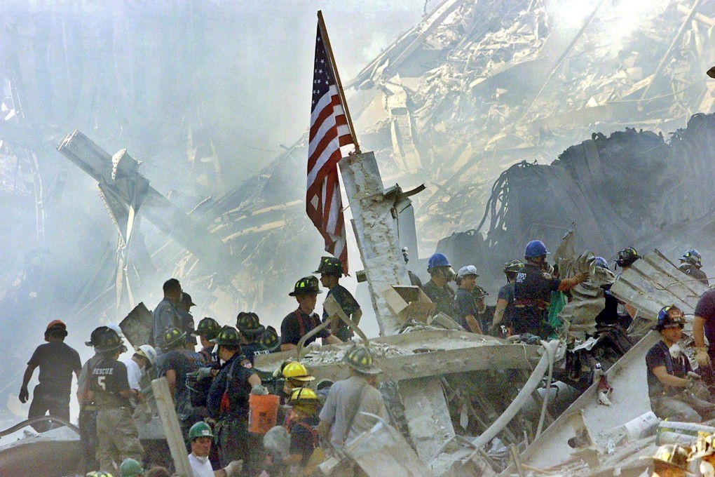 A US flag is posted in the rubble of the World Trade Centre in New York on September 13, 2001. On September 11, 2001, during a series of coordinated terror attacks using hijacked airplanes, two airplanes were flown into the World Trade Centre’s twin towers causing the collapse of both towers. Photo: EPA-EFE