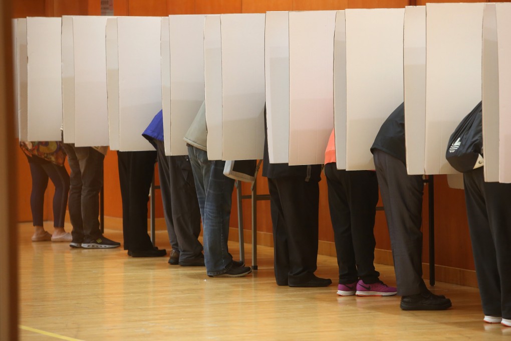 Voters cast their ballots at a polling station in Quarry Bay Community Hall in the 2016 Election Committee subsector elections. The upcoming subsector polls will be the first held under the new electoral system. Photo: Sam Tsang