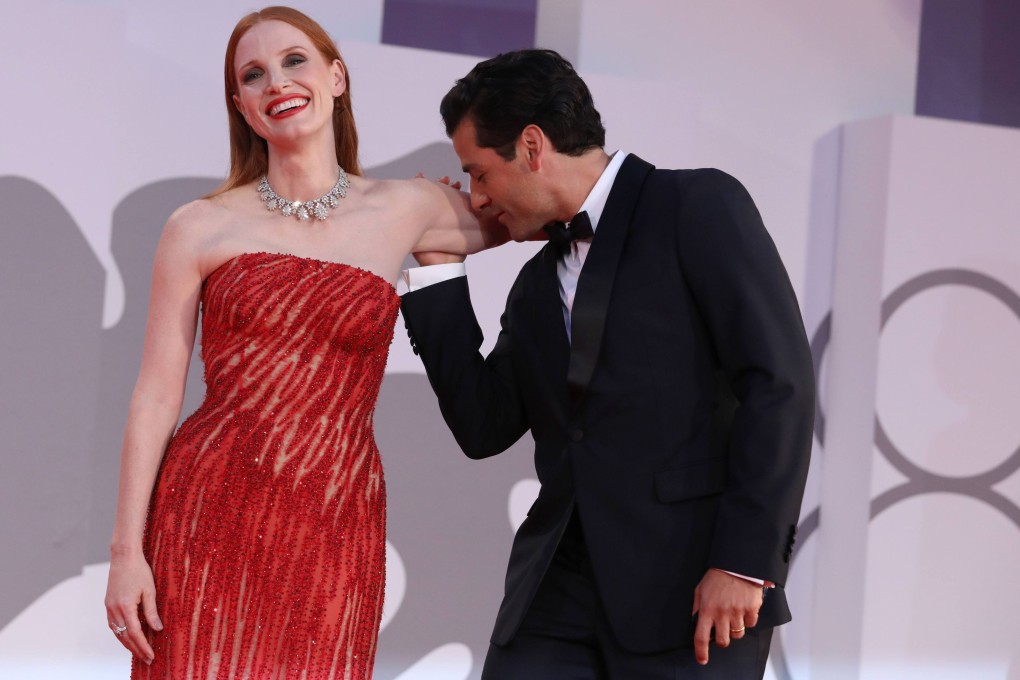 Images of Oscar Isaac (right) kissing the inside of Jessica Chastain’s bare arm on the red carpet at the Venice Film Festival went instantly viral. Photo: Getty Images