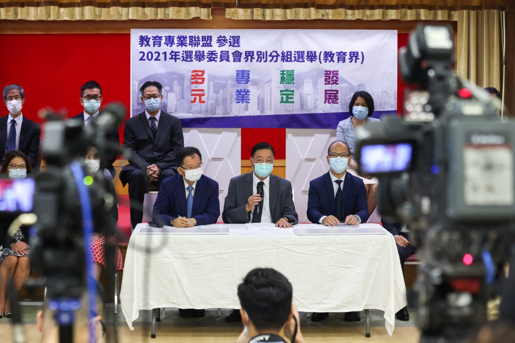 Thirteen educators, including (front, from the left) Ho Hon-kuen, Chiu Cheung-ki and Wong Kam-leung, hold a press conference at Causeway Bay Victoria Kindergarten & International Nursery on August 9 before they submit their applications to contest the Election Committee education subsector election. Photo: Nora Tam