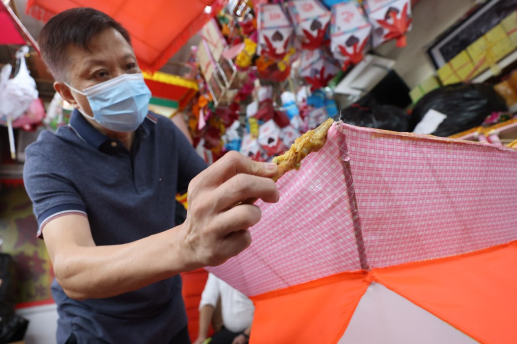 One of the last traditional Chinese lantern makers in Hong Kong, Ha Chung-kin works on an order at his shop in Sai Ying Pun. He thinks the local lantern-making industry will be dead within 40 years. Photo: Nora Tam