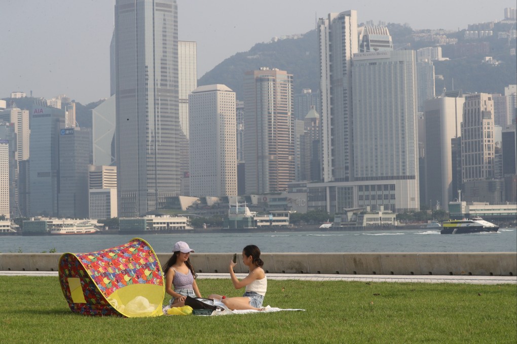People enjoy a sunny day at West Kowloon Waterfront Promenade on July 23. Photo: Edmond So