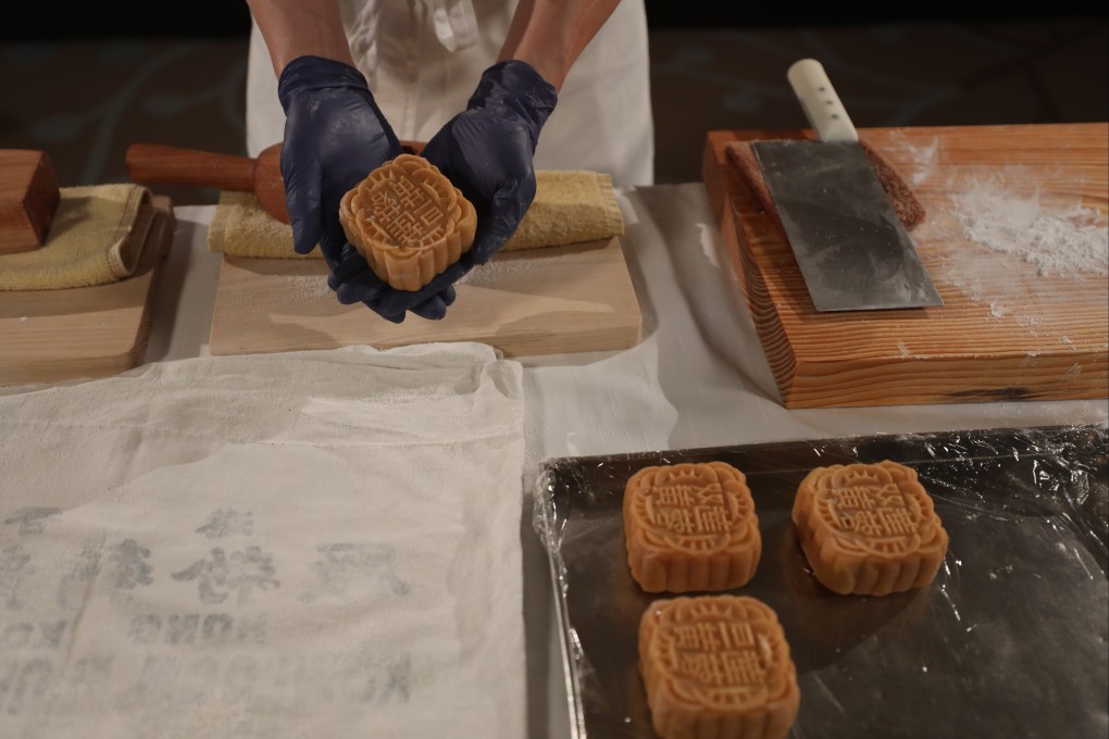 Mid-Autumn Festival is mooncake time. Tse Sun-fuk shows a traditional mooncake fresh out of the mould. Photo: Xiaomei Chen