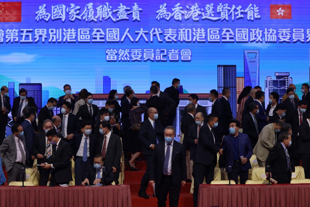 The fifth sector of the Election Committee, comprising Hong Kong deputies to the National People’s Congress and Hong Kong members of the National Committee of the Chinese People’s Political Consultative Conference, hold a press conference at the Hong Kong Convention and Exhibition Centre in Wan Chai on September 9. Photo: Nora Tam