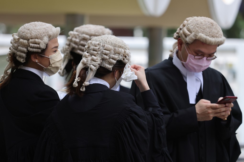 Legal practitioners feel the heat outside the Court of Final Appeal building in Central on May 29. Photo: Nora Tam