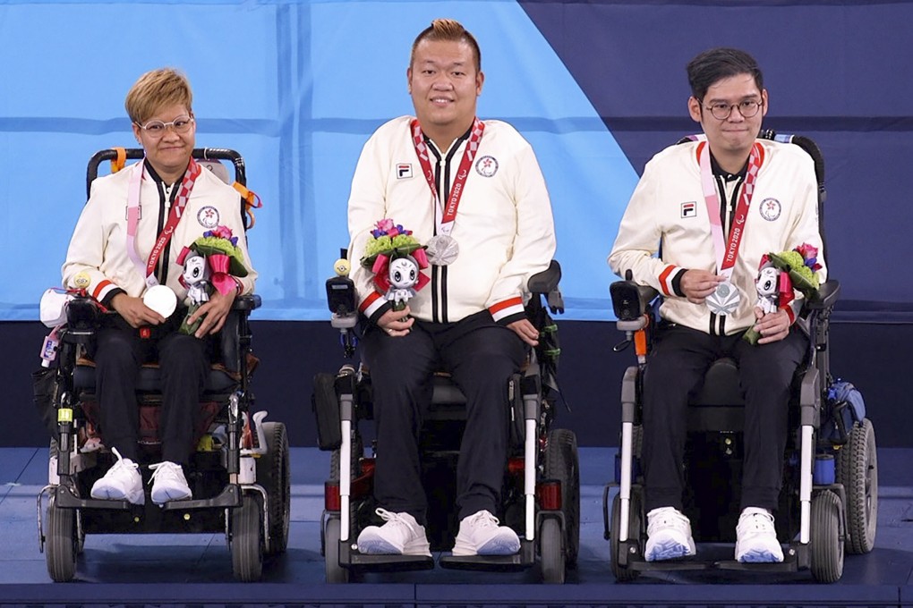 Hong Kong’s Vivian Lau Wai-yan, Leung Yuk-wing and reserve player Raymond Wong Kwan-hang celebrate on the podium after winning silver in the mixed pairs Boccia BC4 event at the Tokyo Paralympics earlier this month. Photo: HK Paralympic Committee