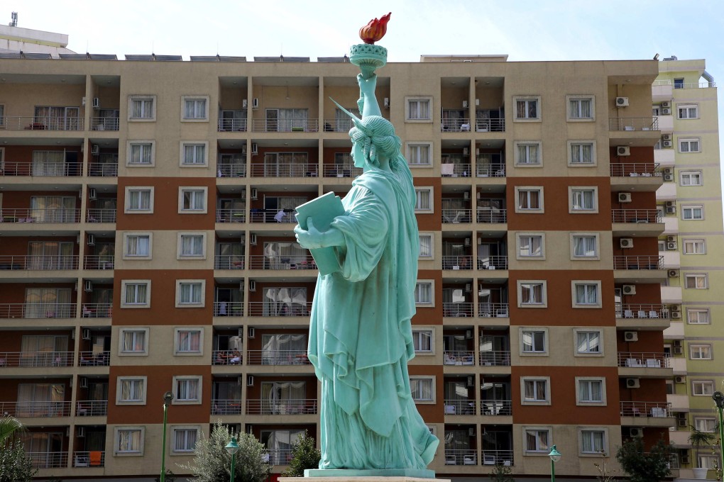 A mock-up of the Statue of Liberty is seen on September 11 outside a tourist resort in the city of Shengjin, Albania, which has taken in Afghan refugees. US coercive diplomacy hurts its relations with allies, increases mistrust and depletes its soft power. Photo: AFP