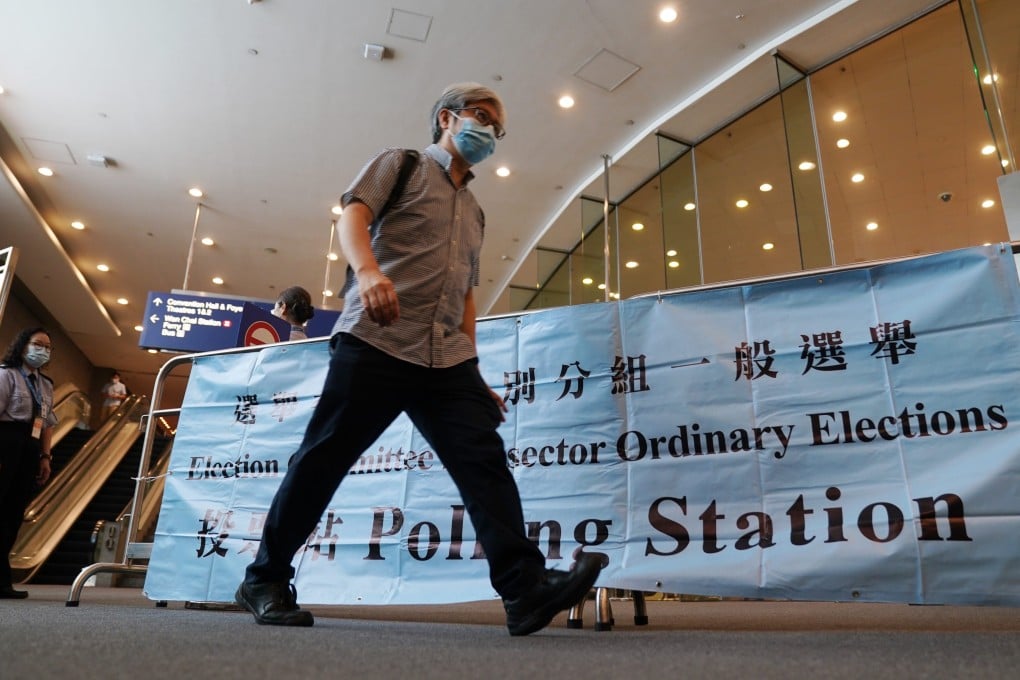 A citizen leaves after casting his ballot for the Election Committee polls, at the Hong Kong Convention and Exhibition Centre, in Wan Chai, on September 19. The turnout of about 90 per cent for the election, the first to be held after electoral reforms this year, signals voter confidence in the system. Photo: Xinhua