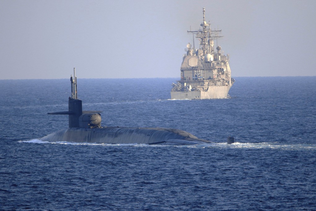 The guided-missile submarine USS Georgia, a nuclear-powered model that Australia might soon deploy, transits the Strait of Hormuz on December 21, 2020. Photo: TNS