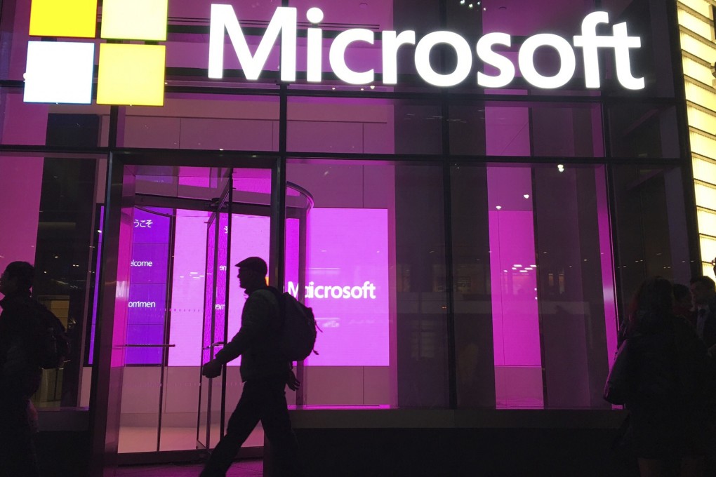 People walk near a Microsoft office in New York in November, 2016. Large tech firms such as Microsoft have been accused of stifling innovation through their acquisitions and competitive practices. Photo: AP