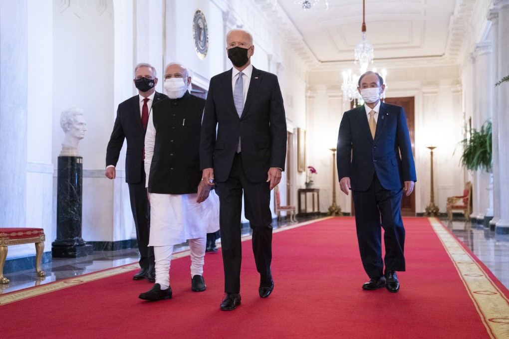 President Joe Biden walks to the Quad summit with (from left) Australian Prime Minister Scott Morrison, Indian Prime Minister Narendra Modi and Japanese Prime Minister Yoshihide Suga, in the East Room of the White House, on September 24 in Washington. Photo: AP