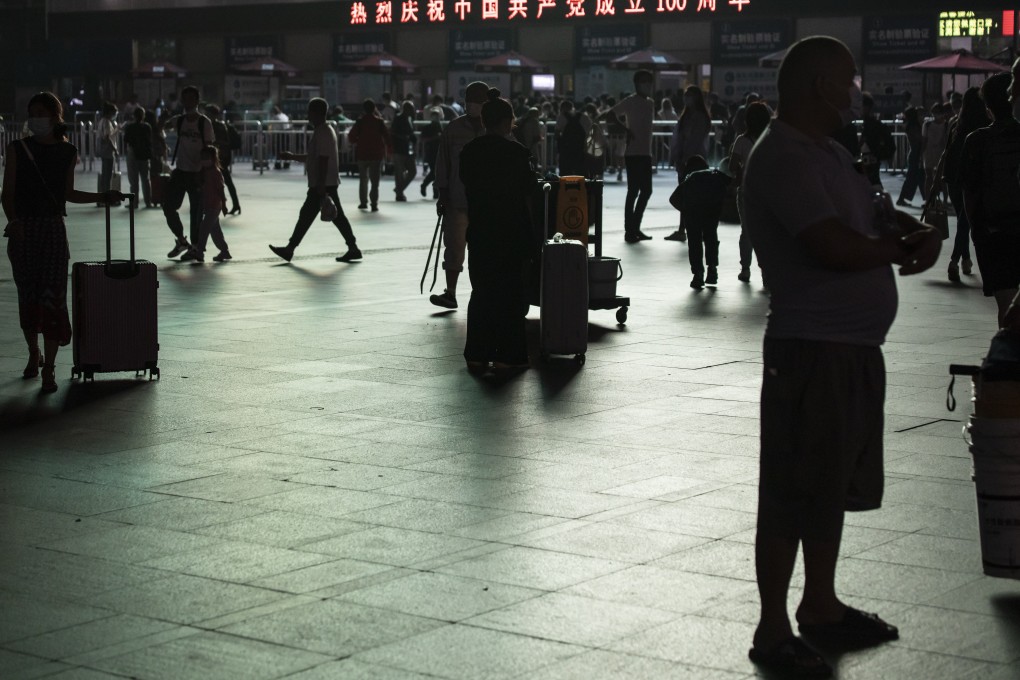Travellers gather in the square outside Shanghai Railway Station on September 29. The generator systems that engage once the regular electric-grid flow gets cut off are powered by fossil fuel. Why not use clean energy? Photo: Bloomberg