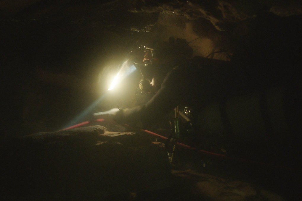 A scene from The Rescue showing a diver navigating through an underwater cave. Photo: National Geographic