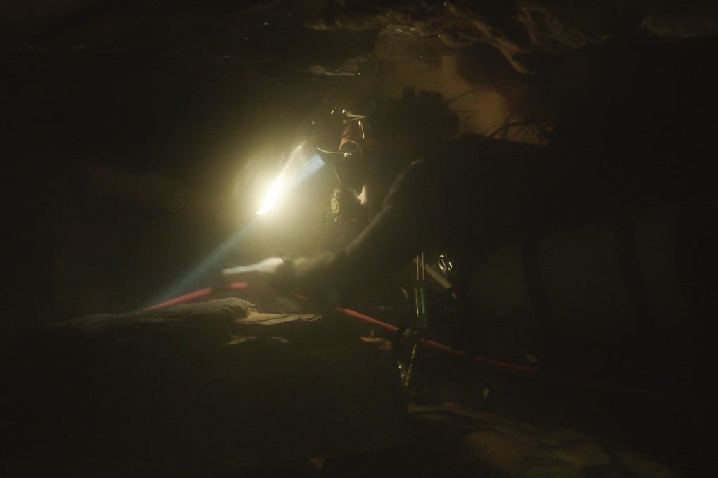 A scene from The Rescue showing a diver navigating through an underwater cave. Photo: National Geographic