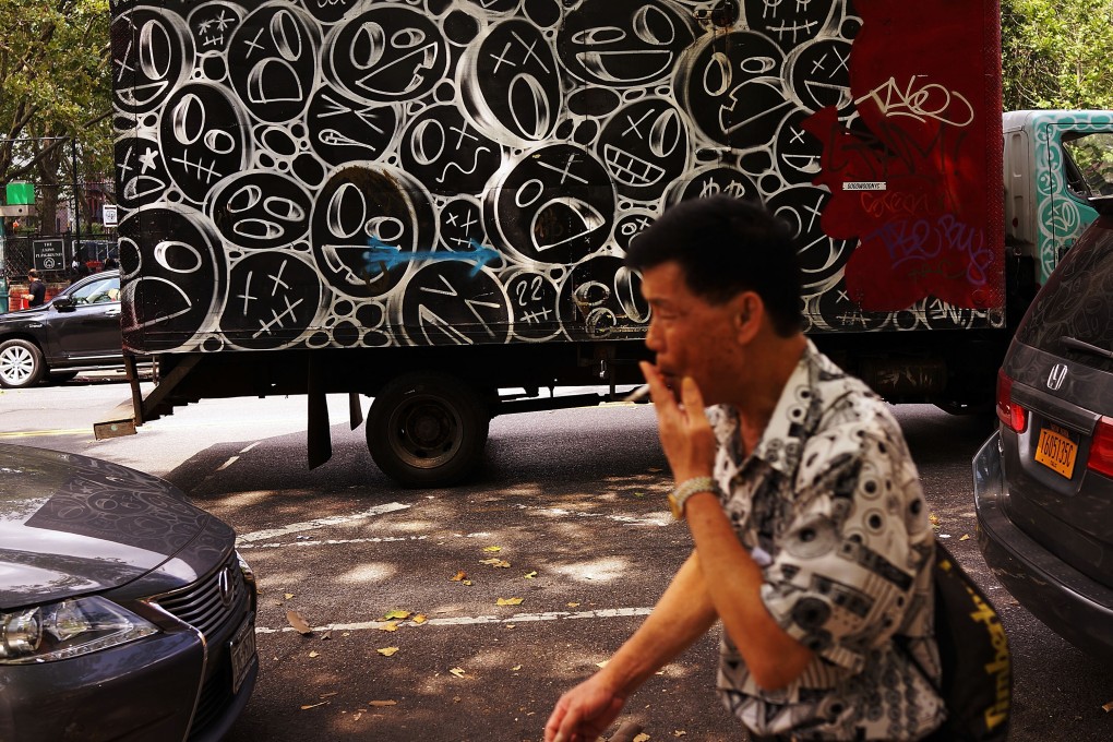 A man walks through New York’s Chinatown district on July 11, 2014. Census Bureau data at the time showed Chinese people made up the second-largest foreign-born group in New York after immigrants from the Dominican Republic, with the Chinese community growing by 34 per cent in the previous decade to the Dominicans’ 3 per cent. Photo: AFP