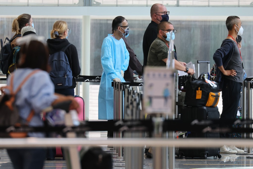 Inbound travellers arriving at Hong Kong International Airport get in line to be transported to quarantine hotels in the city on September 2. Photo: Dickson Lee