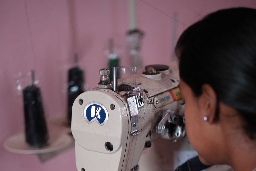 A 14-year-old girl who has started homebased tailoring work subcontracted by factories during the pandemic. Photo: Shamsheer Yousaf
